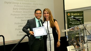Feliberto Feliz receiving the ASB award from Lisanette Rosario.