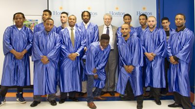 Hostos President David Gomez. Graduation class. Brandon Stewart, Brandon Reed, Carlos Colon, Christopher Santiago, Fuday Robinson,  Hassan Thomas, Kadeem Sykes, Kyle Sone, Ralph Colon, Roberto Ramos, Ronelle Anthony, Shaun Latorre, Trevon Vizcarrondo, Thomas Vasquez, and William Rivera.