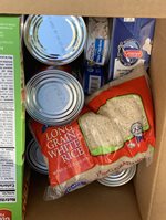 Box of canned food, rice and cereal