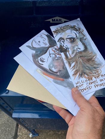 Professor Scott Dropping Painted Envelopes into a mailbox